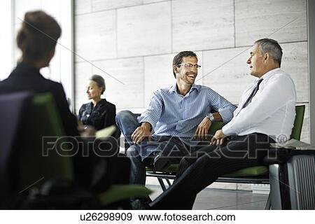 Men talking in waiting room View Large Photo Image Stock Photo - Men talking in waiting room. Fotosearch