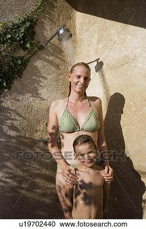 Stock Image - Mother and son in shower. Fotosearch