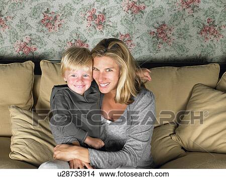 Picture - mother and son watching television. Fotosearch