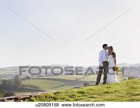 Stock Photo - Newly weds on wedding day. Fotosearch