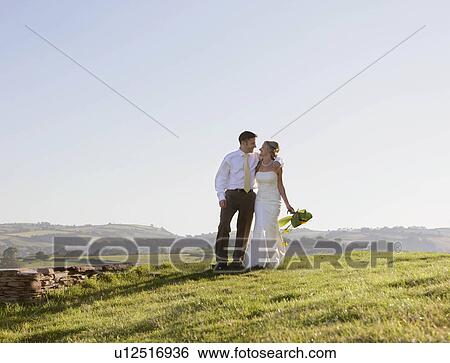Stock Photograph - Newly weds on wedding day. Fotosearch
