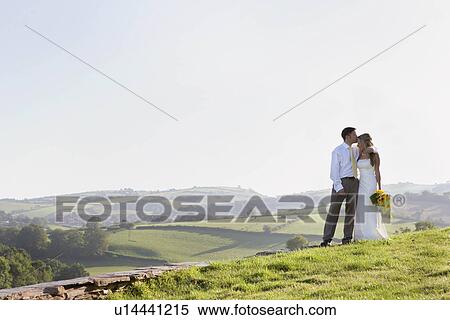 Stock Photography - Newly weds on wedding day. Fotosearch