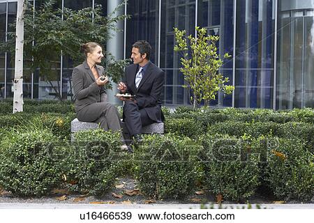 Stock Photo - Office workers lunch break. Fotosearch