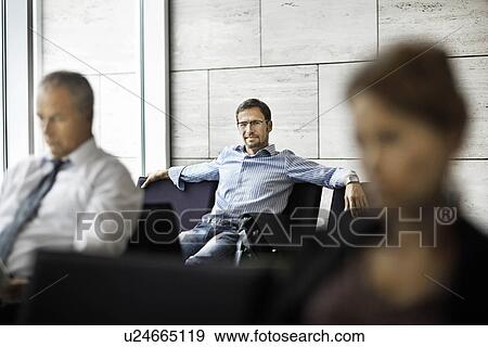 Stock Photo - People in a waiting room. Fotosearch