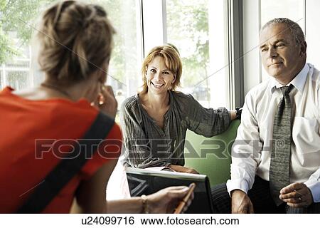 Stock Photograph - People with good attitude, working. Fotosearch