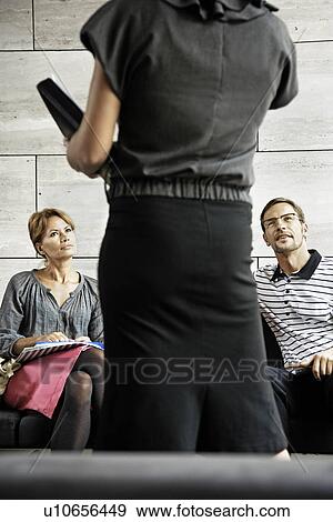 Stock Photo - People working with their assistant. Fotosearch