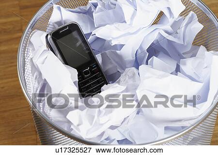 Stock Photo - Phone in the bin. Fotosearch