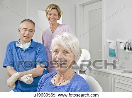 Stock Photography - Portrait dentist assistant and patient. Fotosearch