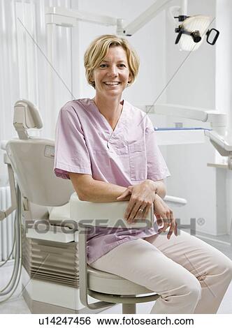 Stock Photograph - Portrait of a female dental assistant. Fotosearch