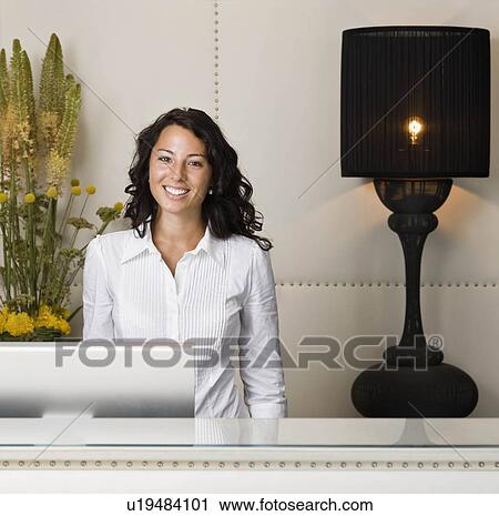 Stock Image - Portrait of a female receptionist. Fotosearch