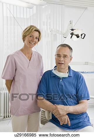 Portrait of a male dentist and assistant View Large Photo Image Stock Photography - Portrait of a male dentist and assistant. Fotosearch