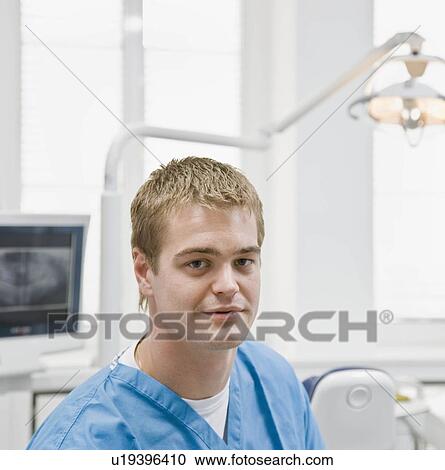 Stock Image - Portrait of a male dentist. Fotosearch