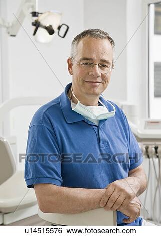 Stock Photograph - Portrait of a male dentist. Fotosearch