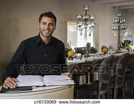 Portrait of a male host to a restaurant View Large Photo Image Stock Photo - Portrait of a male host to a restaurant. Fotosearch
