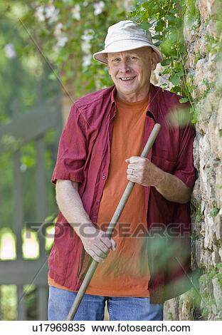 Portrait of a man gardening View Large Photo Image Stock Photography - Portrait of a man gardening. Fotosearch