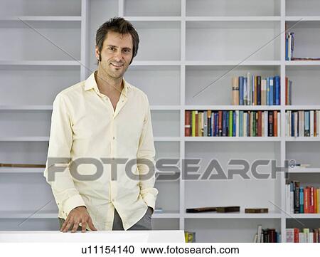 Stock Image - Portrait of a man in a study. Fotosearch
