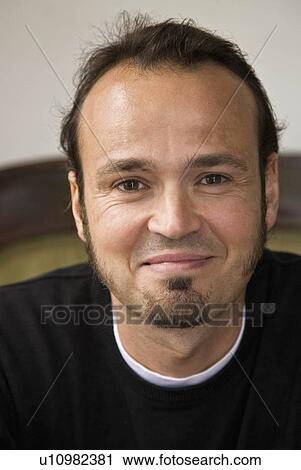 Portrait of a man smiling View Large Photo Image Stock Image - Portrait of a man smiling. Fotosearch