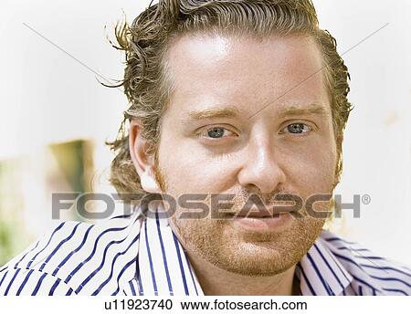 Stock Image - Portrait of a man smiling. Fotosearch