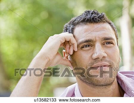 Stock Image - Portrait of a man smiling. Fotosearch