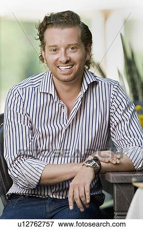 Stock Photo - Portrait of a man smiling. Fotosearch