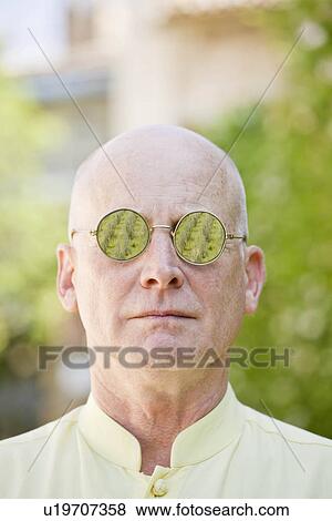 Stock Photo - Portrait of a man with glasses. Fotosearch