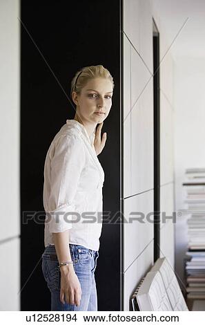 Picture - Portrait of a woman in a living room. Fotosearch