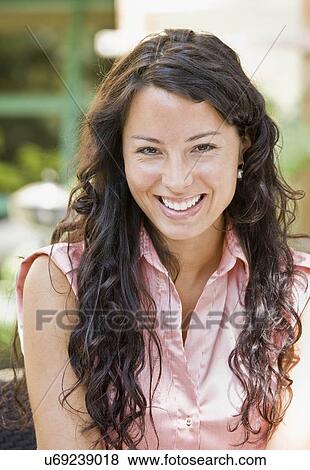Portrait of a woman smiling View Large Photo Image Stock Photo - Portrait of a woman smiling. Fotosearch