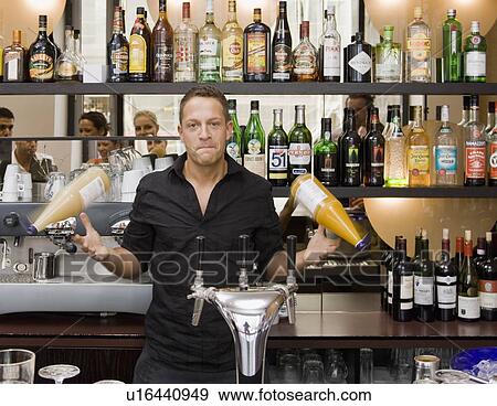 Portrait of bartender spinning drinks View Large Photo Image Stock Photo - Portrait of bartender spinning drinks. Fotosearch