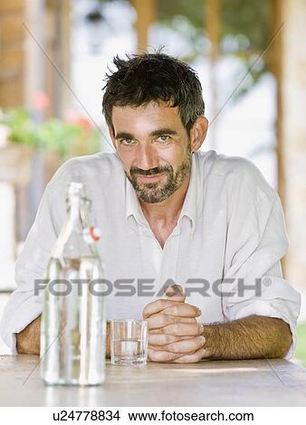 Portrait of man relaxing in a garden View Large Photo Image Picture - Portrait of man relaxing in a garden. Fotosearch
