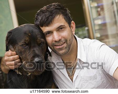 Portrait of man with his dog View Large Photo Image Stock Image - Portrait of man with his dog. Fotosearch