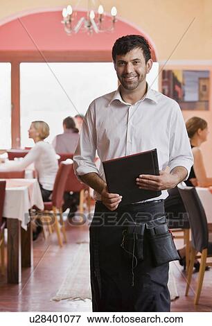 Portrait of waiter with menus in hand View Large Photo Image Stock Photo - Portrait of waiter with menus in hand. Fotosearch