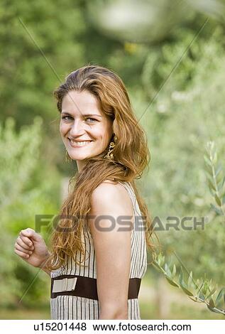 Portrait of woman in olive grove View Large Photo Image Stock Photo - Portrait of woman in olive grove. Fotosearch