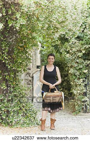 Portrait of woman with basket View Large Photo Image Stock Photo - Portrait of woman with basket. Fotosearch