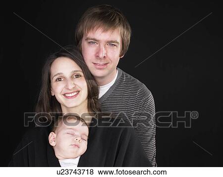 smiling mother and father with baby View Large Photo Image Stock Photo - smiling mother and father with baby. Fotosearch