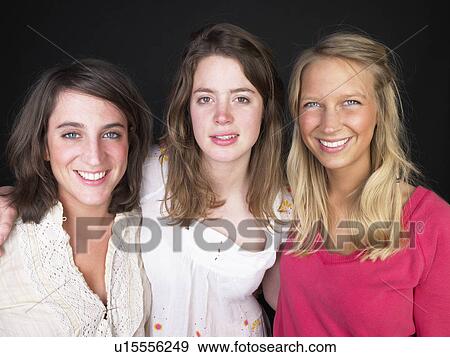 Stock Photo - three girlfriends smiling. Fotosearch