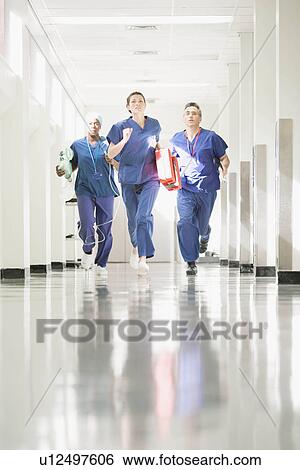 Stock Photograph - Three medical staff running. Fotosearch