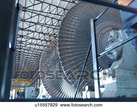 Stock Photo - Turbine Engineers In Turbine Hall. Fotosearch