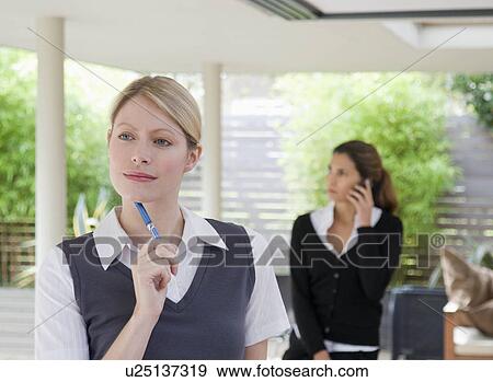 Stock Photo - Two female business associates.. Fotosearch