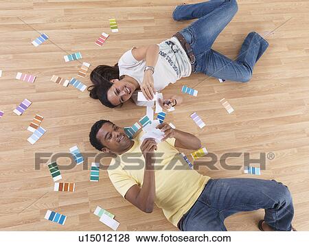 Two friends choosing paint colours View Large Photo Image Stock Photo - Two friends choosing paint colours. Fotosearch