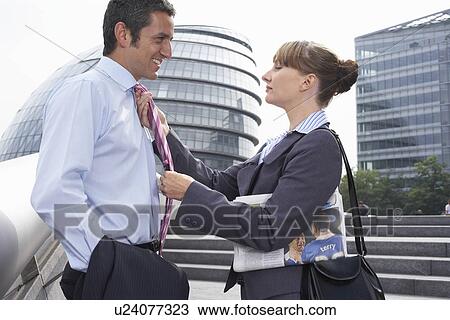 Two office workers outside talking View Large Photo Image Stock Image - Two office workers outside talking. Fotosearch