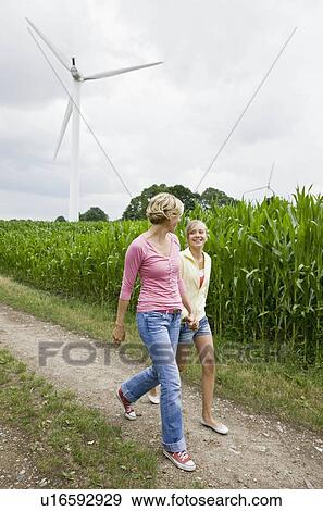 Stock Photo - Woman and girl taking a walk. Fotosearch