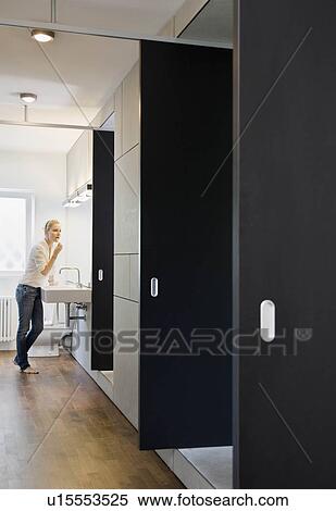 Stock Photography - Woman applying makeup. Fotosearch