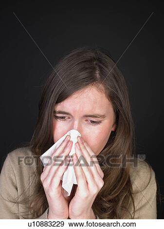 woman blowing her nose View Large Photo Image Stock Photo - woman blowing her nose. Fotosearch
