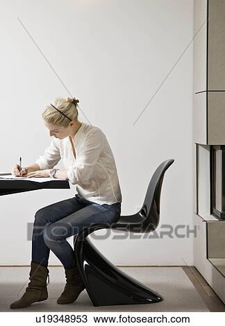 Stock Image - Woman doing bills. Fotosearch