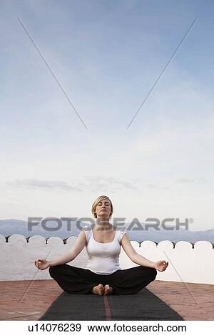 Woman doing yoga View Large Photo Image Stock Photo - Woman doing yoga. Fotosearch