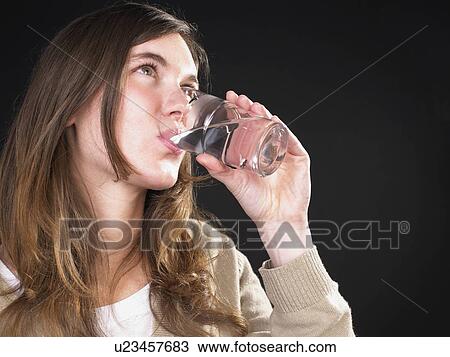 Stock Image - woman drinking water. Fotosearch
