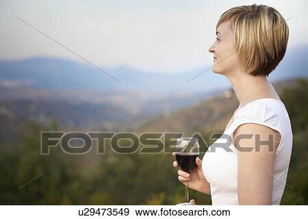 Stock Photo - Woman drinking wine. Fotosearch
