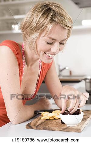 Stock Photograph - Woman eating food. Fotosearch