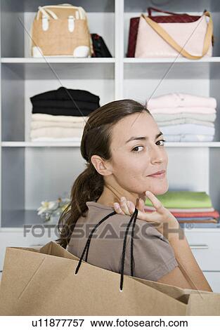 Woman holding a shopping bag. View Large Photo Image Stock Photo - Woman holding a shopping bag.. Fotosearch