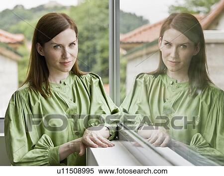 Woman looking out the window View Large Photo Image Stock Photography - Woman looking out the window. Fotosearch
